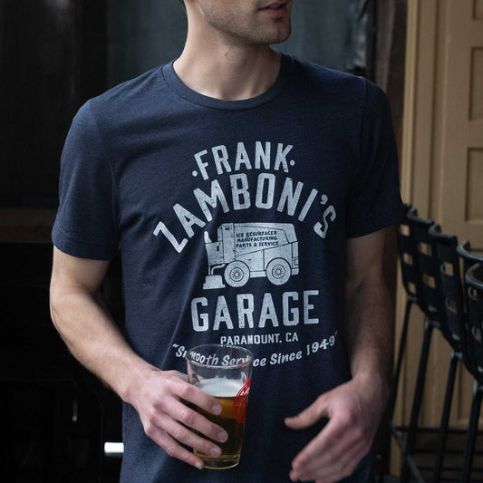 Vintage Frank Zamboni's Garage tee featuring distressed Zamboni machine graphic, soft cotton blend, unisex fit, eco-friendly and USA printed