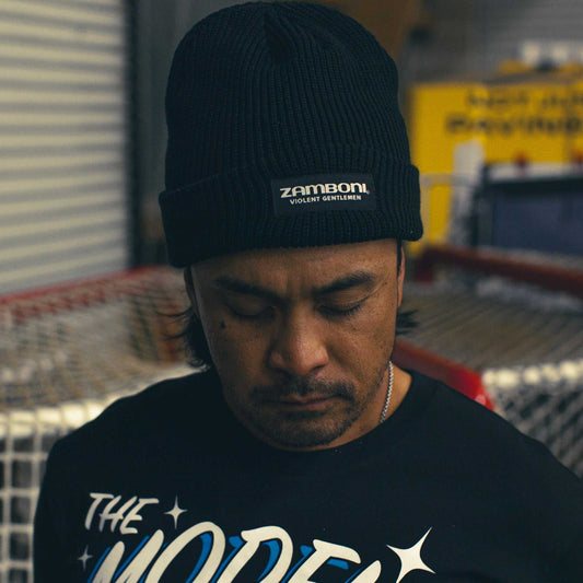 Zamboni cuff beanie in ribbed knit keeping head warm on icy rink