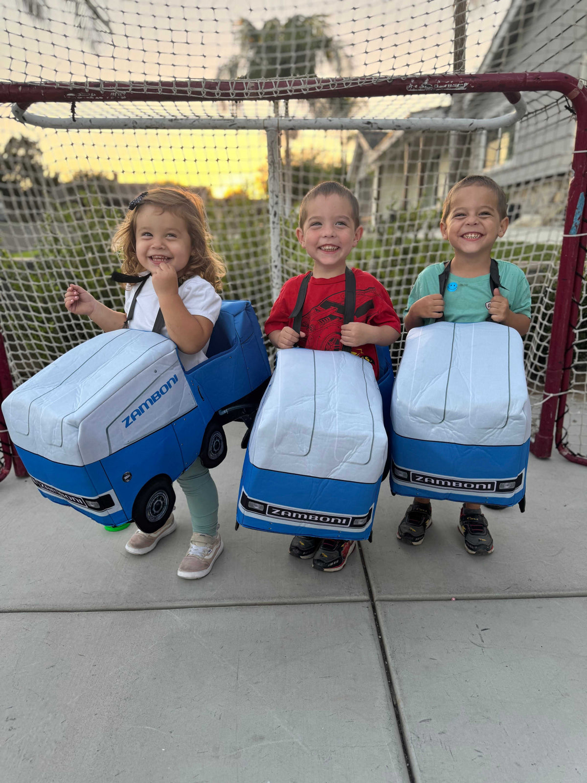 Toddler Ride Along Zamboni costumes in blue and white foam with printed wheels, headlights, and Zamboni branding.
