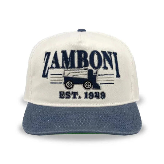 Snapback cap in cream cotton with a washed navy brim and embroidered Zamboni logo; Adult Zamboni Ride-Along Costume style detail.