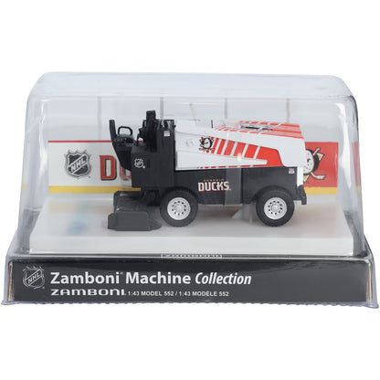 Die-cast Zamboni collectible with black and white Anaheim Ducks graphics, displayed under a clear cover; Adult Zamboni Ride-Along Costume is unrelated.