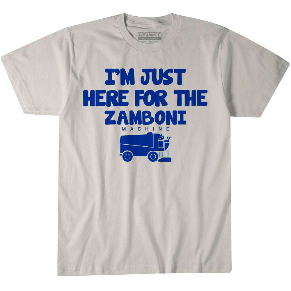 T-shirt reading “I'm Just Here For The Zamboni,” in light gray cotton with bold blue lettering and a Zamboni graphic.