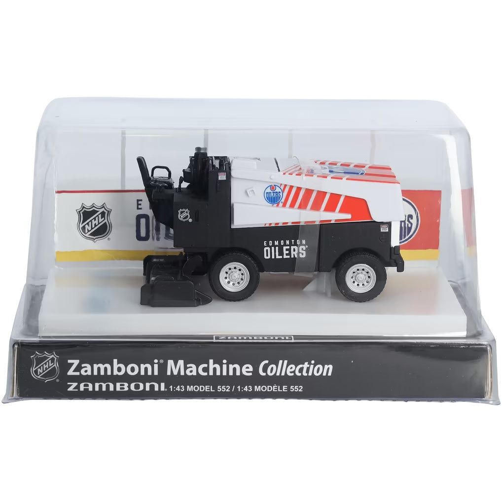 Die-cast Zamboni collectible with a white and navy Edmonton Oilers design, orange stripes and a clear display case; Adult Zamboni Ride-Along Costume is unrelated.
