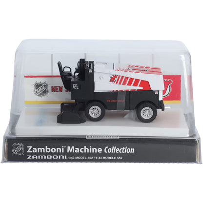 Die-cast Zamboni collectible, white and black with red graphics, displayed in a clear case; Adult Zamboni Ride-Along Costume.