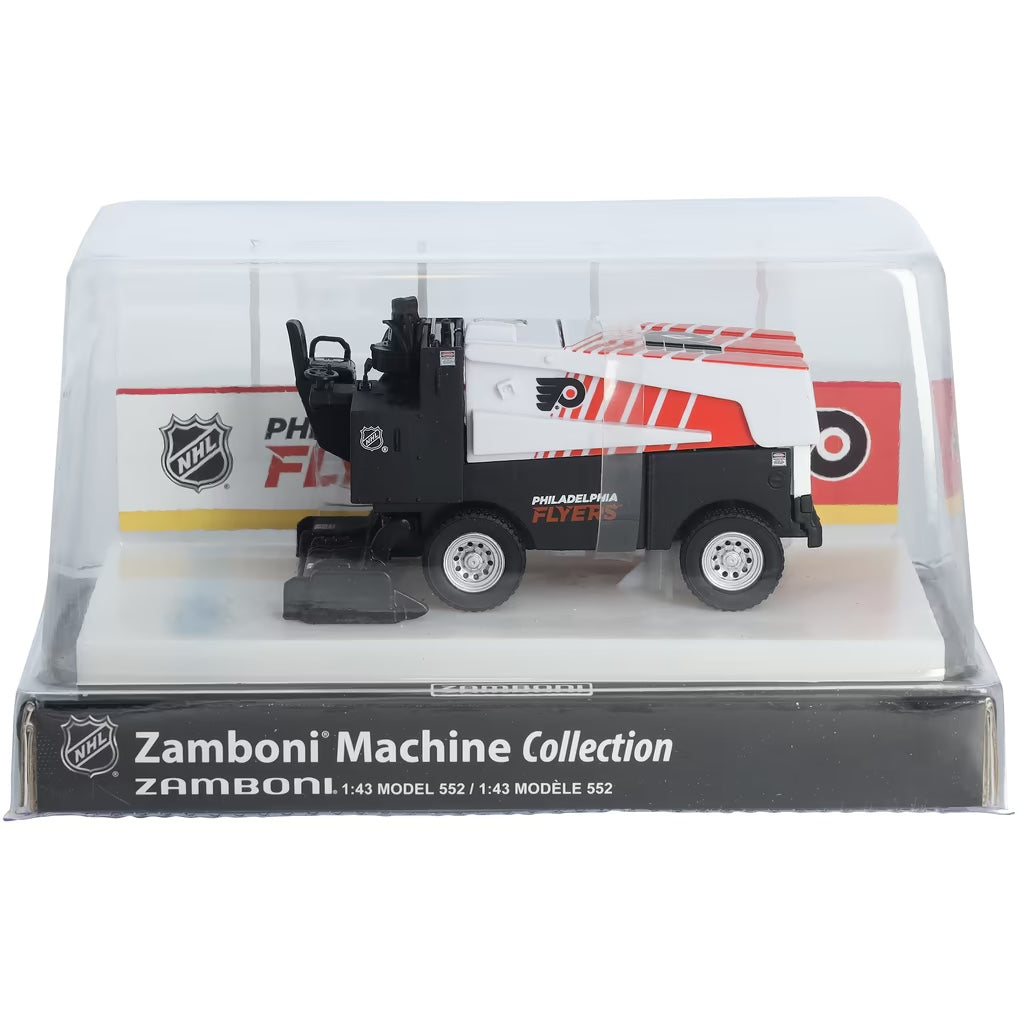 Die-cast Zamboni collectible in white, black, and orange with Philadelphia Flyers graphics, displayed under a clear cover; Adult Zamboni Ride-Along Costume.