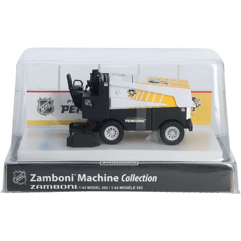Die-cast Zamboni collectible in black, white, and yellow with Pittsburgh Penguins graphics, displayed in a clear case; Adult Zamboni Ride-Along Costume.