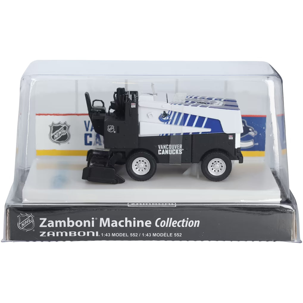 Die-cast Zamboni collectible in black, white, and blue with Vancouver Canucks graphics, displayed on an arena stand; Adult Zamboni Ride-Along Costume.